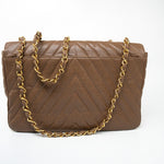 CHANEL Handbag Brown Taupe Caviar Chevron Maxi Single Flap 24K Gold Hardware - Redeluxe