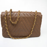 CHANEL Handbag Brown Taupe Caviar Chevron Maxi Single Flap 24K Gold Hardware - Redeluxe