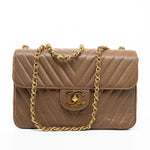 CHANEL Handbag Brown Taupe Caviar Chevron Maxi Single Flap 24K Gold Hardware - Redeluxe