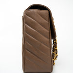 CHANEL Handbag Brown Taupe Caviar Chevron Maxi Single Flap 24K Gold Hardware - Redeluxe