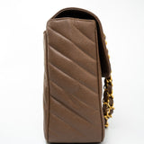 CHANEL Handbag Brown Taupe Caviar Chevron Maxi Single Flap 24K Gold Hardware - Redeluxe