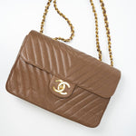 CHANEL Handbag Brown Taupe Caviar Chevron Maxi Single Flap 24K Gold Hardware - Redeluxe