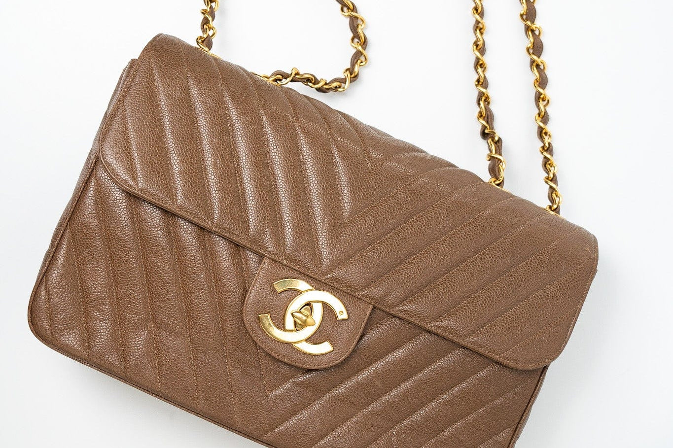 CHANEL Handbag Brown Taupe Caviar Chevron Maxi Single Flap 24K Gold Hardware - Redeluxe