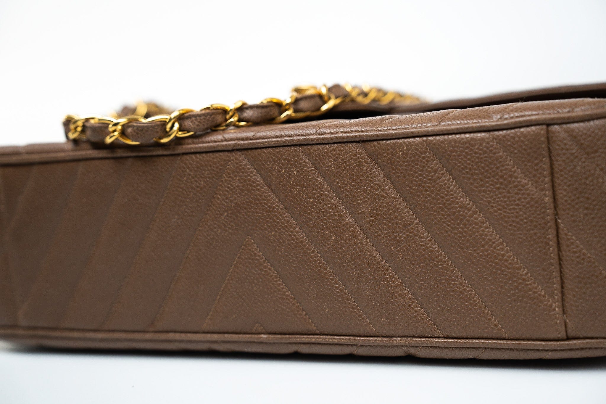 CHANEL Handbag Brown Taupe Caviar Chevron Maxi Single Flap 24K Gold Hardware - Redeluxe