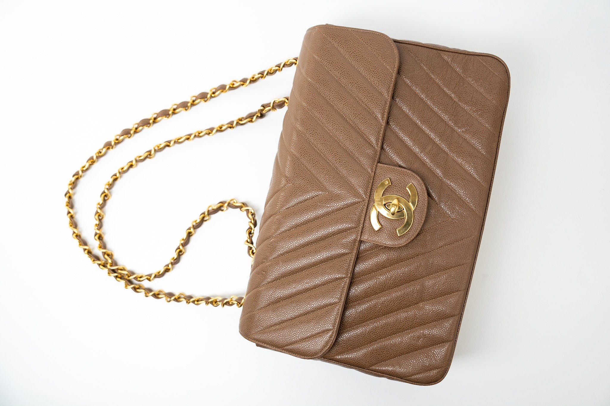 CHANEL Handbag Brown Taupe Caviar Chevron Maxi Single Flap 24K Gold Hardware - Redeluxe