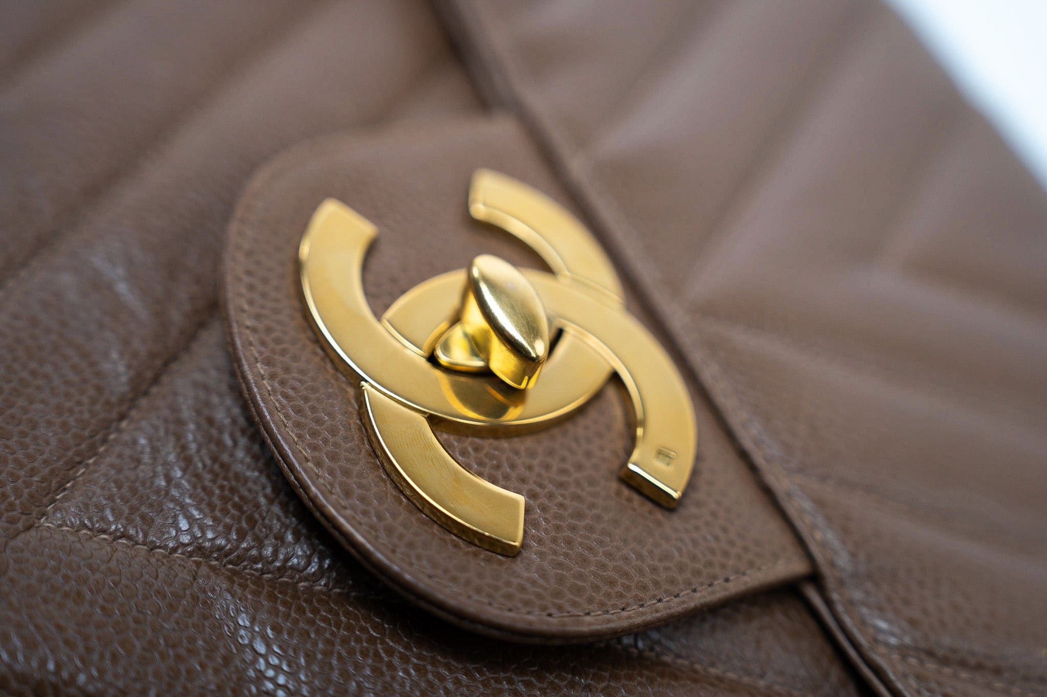 CHANEL Handbag Brown Taupe Caviar Chevron Maxi Single Flap 24K Gold Hardware - Redeluxe