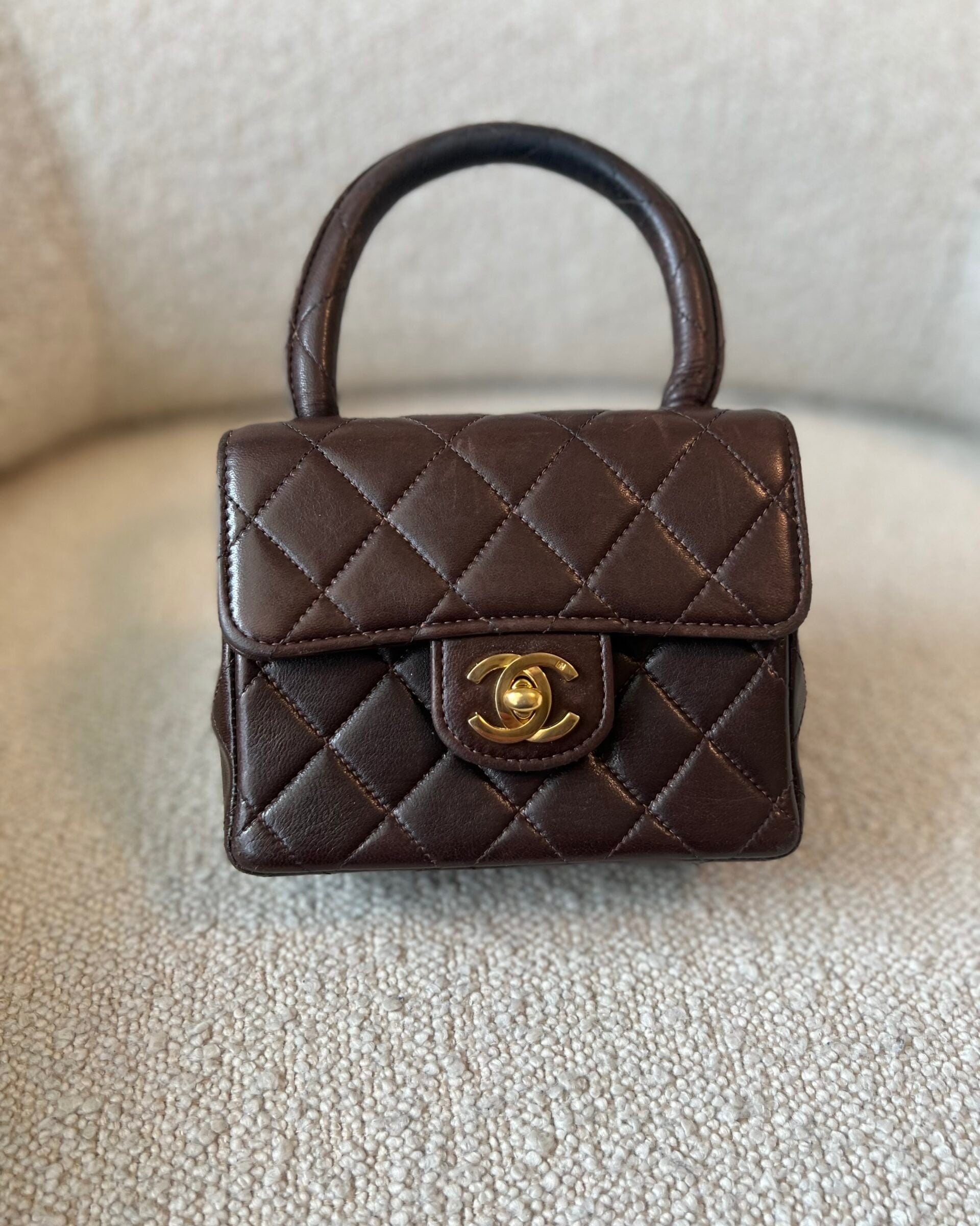 CHANEL Handbag Brown Vintage Brown Lambskin Quilted Micro Mini Kelly with Top Handle GHW - Redeluxe
