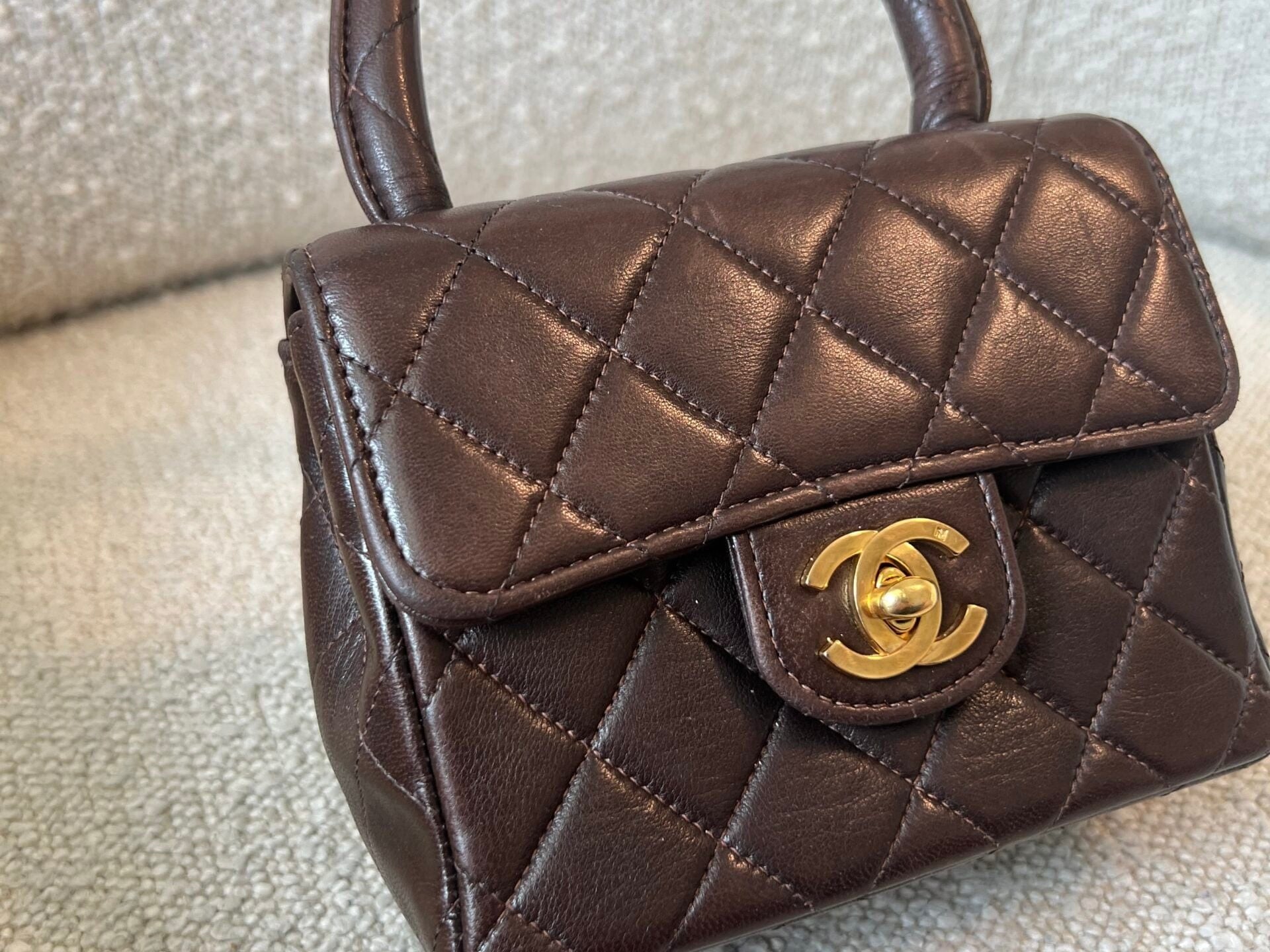 CHANEL Handbag Brown Vintage Brown Lambskin Quilted Micro Mini Kelly with Top Handle GHW - Redeluxe