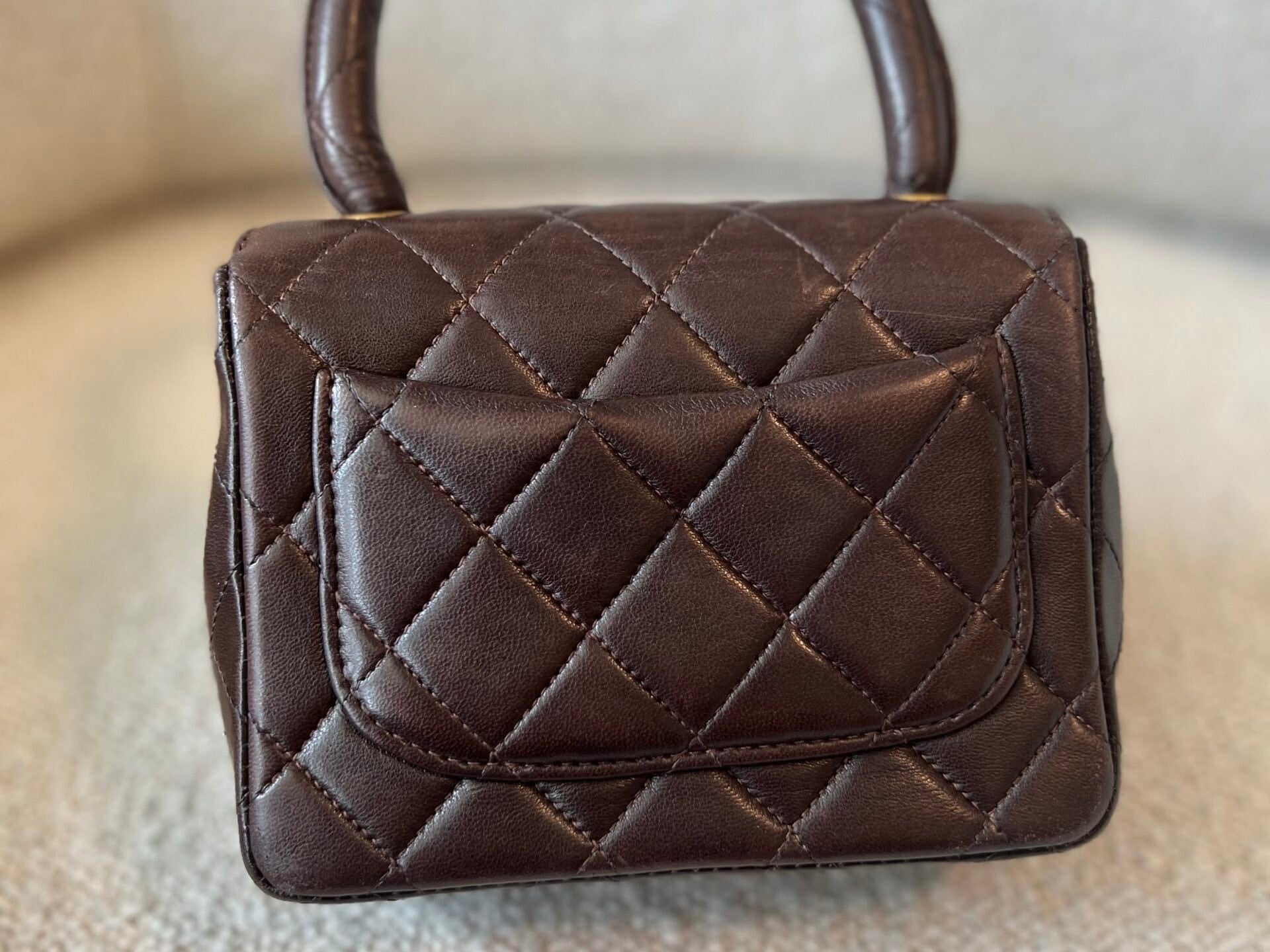 CHANEL Handbag Brown Vintage Brown Lambskin Quilted Micro Mini Kelly with Top Handle GHW - Redeluxe