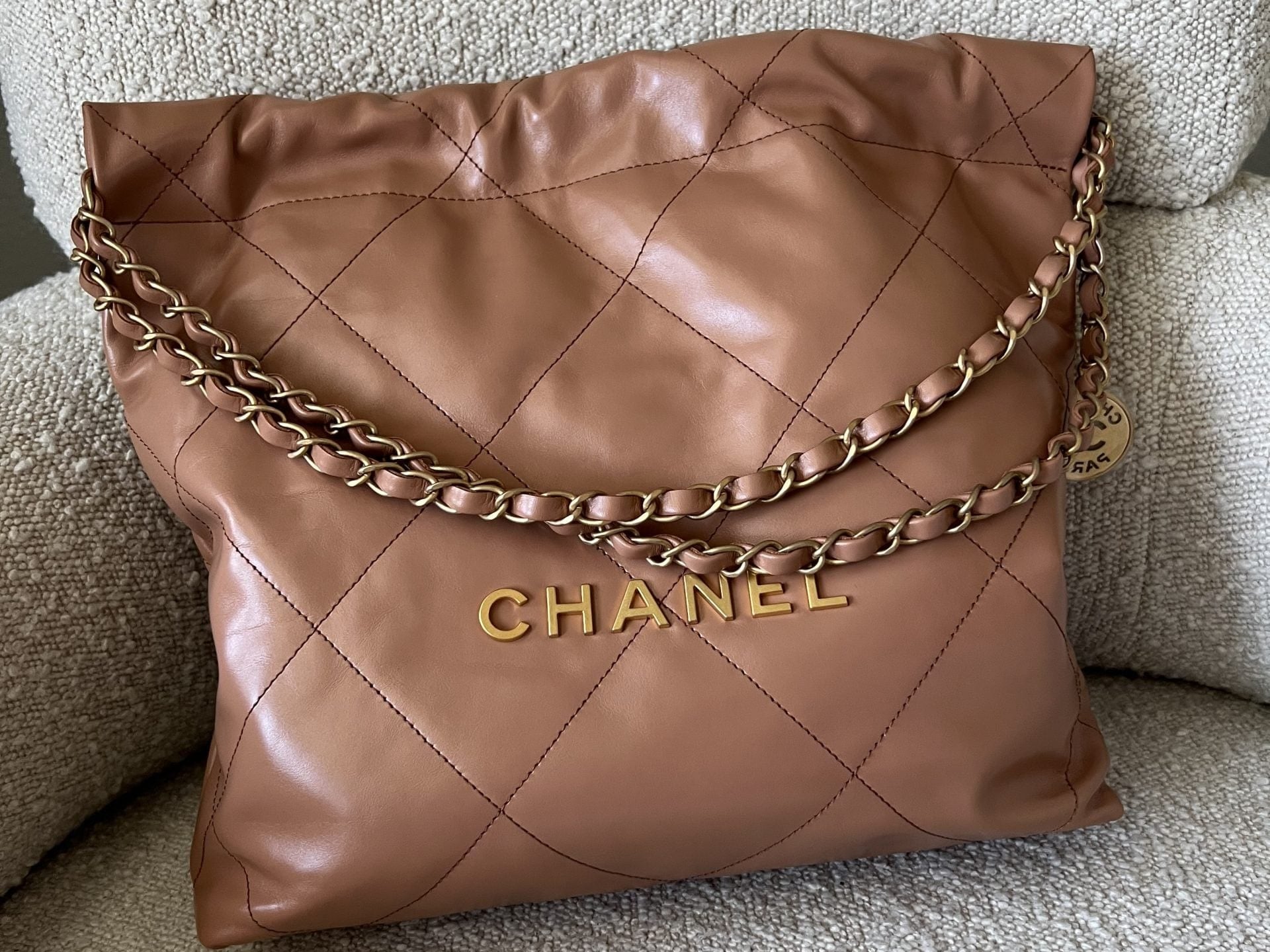 CHANEL Handbag Caramel Shiny Calfskin Quilted 22 Drawstring Bag Small GHW - Redeluxe