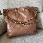 CHANEL Handbag Caramel Shiny Calfskin Quilted 22 Drawstring Bag Small GHW - Redeluxe
