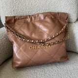CHANEL Handbag Caramel Shiny Calfskin Quilted 22 Drawstring Bag Small GHW - Redeluxe