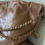 CHANEL Handbag Caramel Shiny Calfskin Quilted 22 Drawstring Bag Small GHW - Redeluxe
