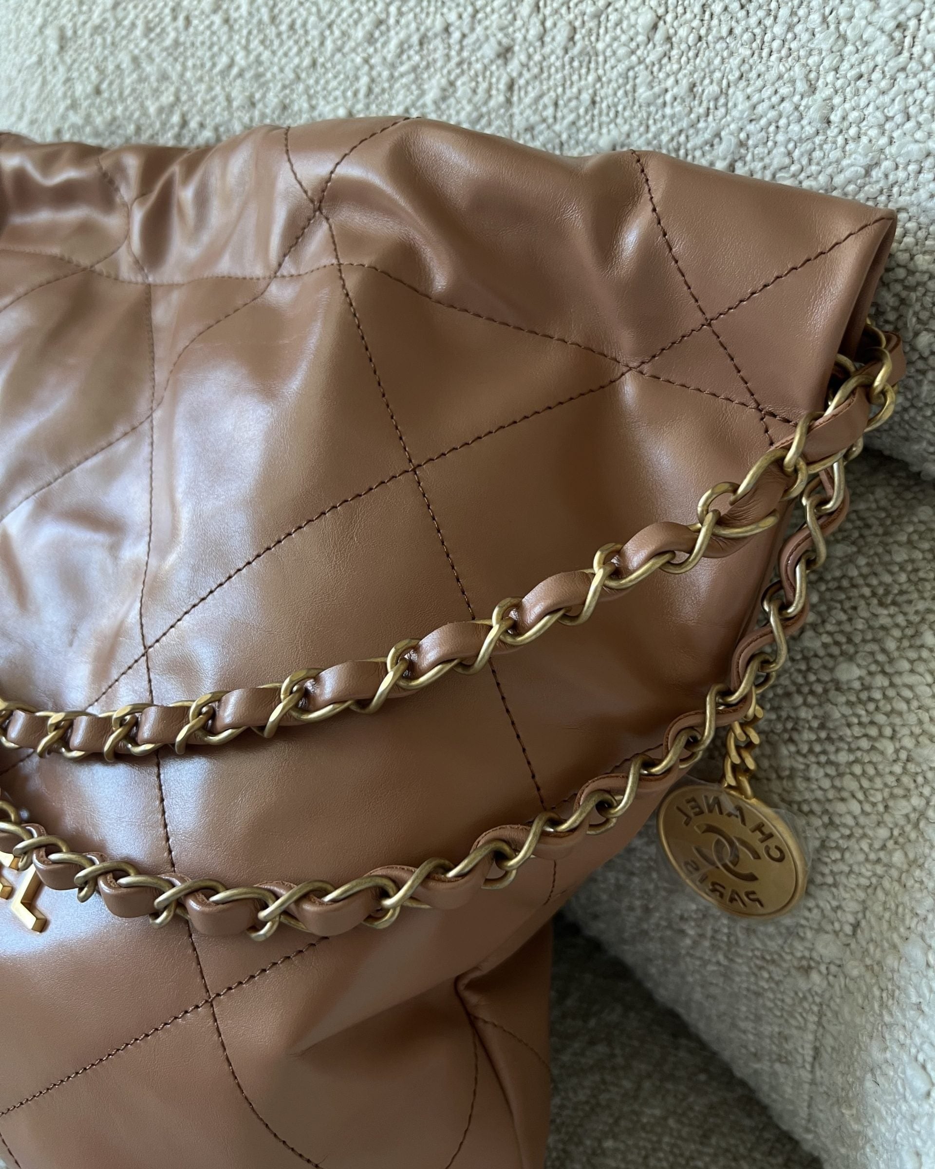 CHANEL Handbag Caramel Shiny Calfskin Quilted 22 Drawstring Bag Small GHW - Redeluxe