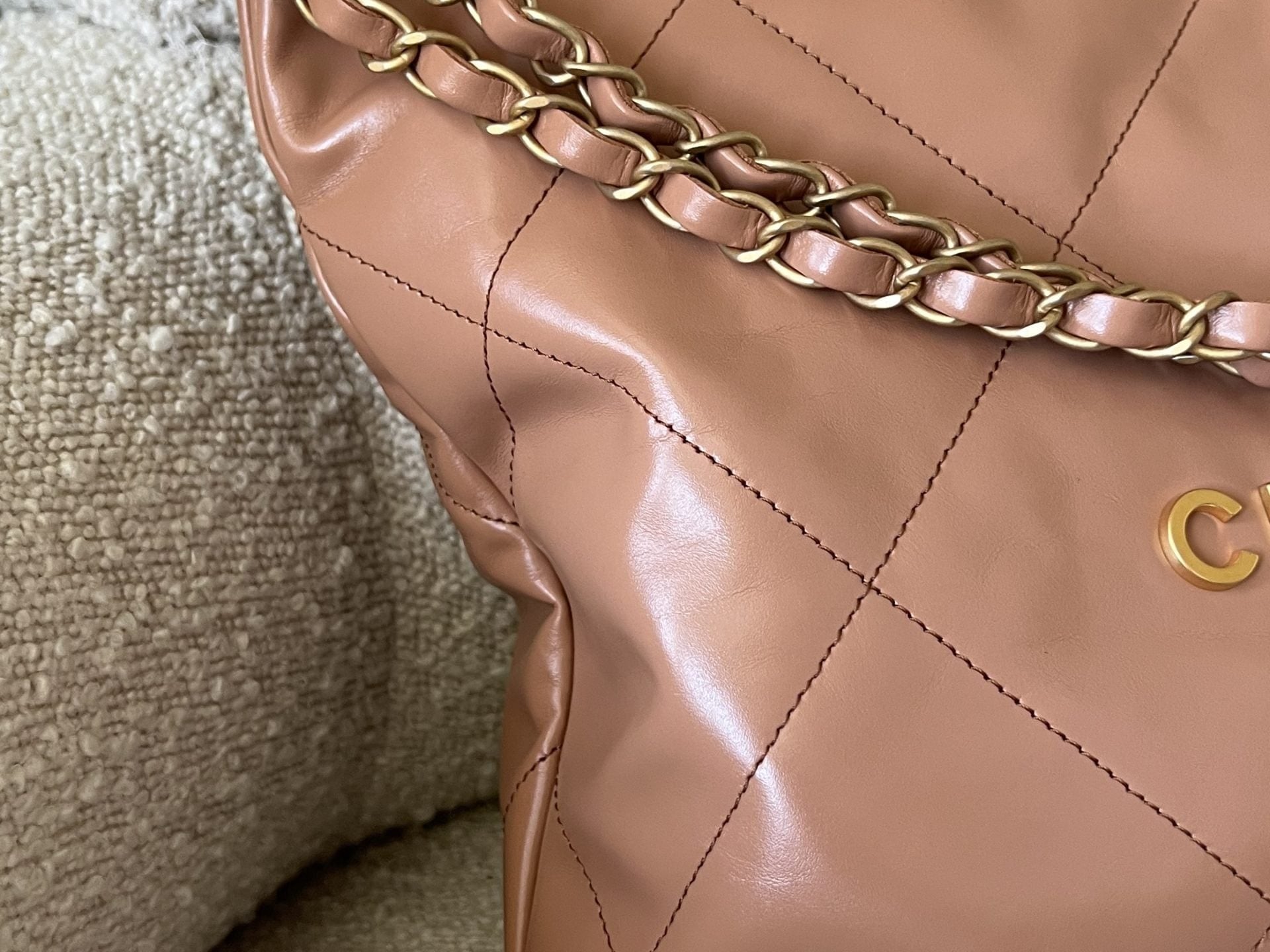 CHANEL Handbag Caramel Shiny Calfskin Quilted 22 Drawstring Bag Small GHW - Redeluxe