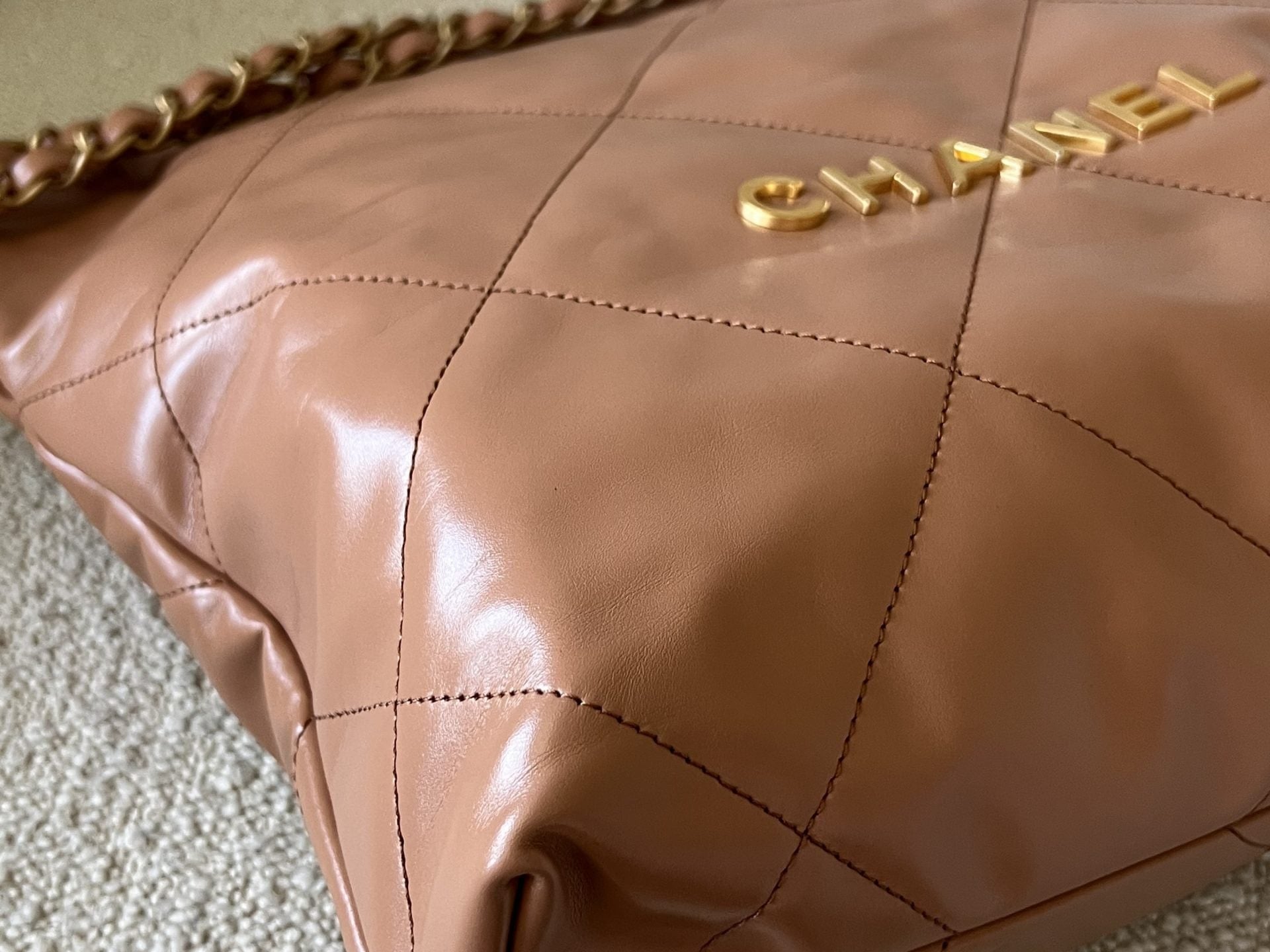 CHANEL Handbag Caramel Shiny Calfskin Quilted 22 Drawstring Bag Small GHW - Redeluxe