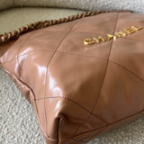 CHANEL Handbag Caramel Shiny Calfskin Quilted 22 Drawstring Bag Small GHW - Redeluxe