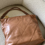 CHANEL Handbag Caramel Shiny Calfskin Quilted 22 Drawstring Bag Small GHW - Redeluxe