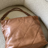 CHANEL Handbag Caramel Shiny Calfskin Quilted 22 Drawstring Bag Small GHW - Redeluxe