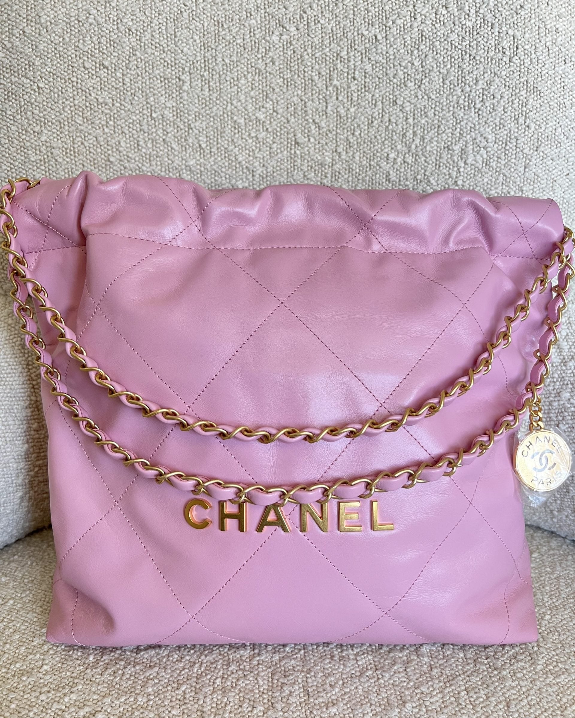 CHANEL Handbag Chanel 22 Pink Shiny Calfskin Quilted Drawstring Bag Small GHW - Redeluxe