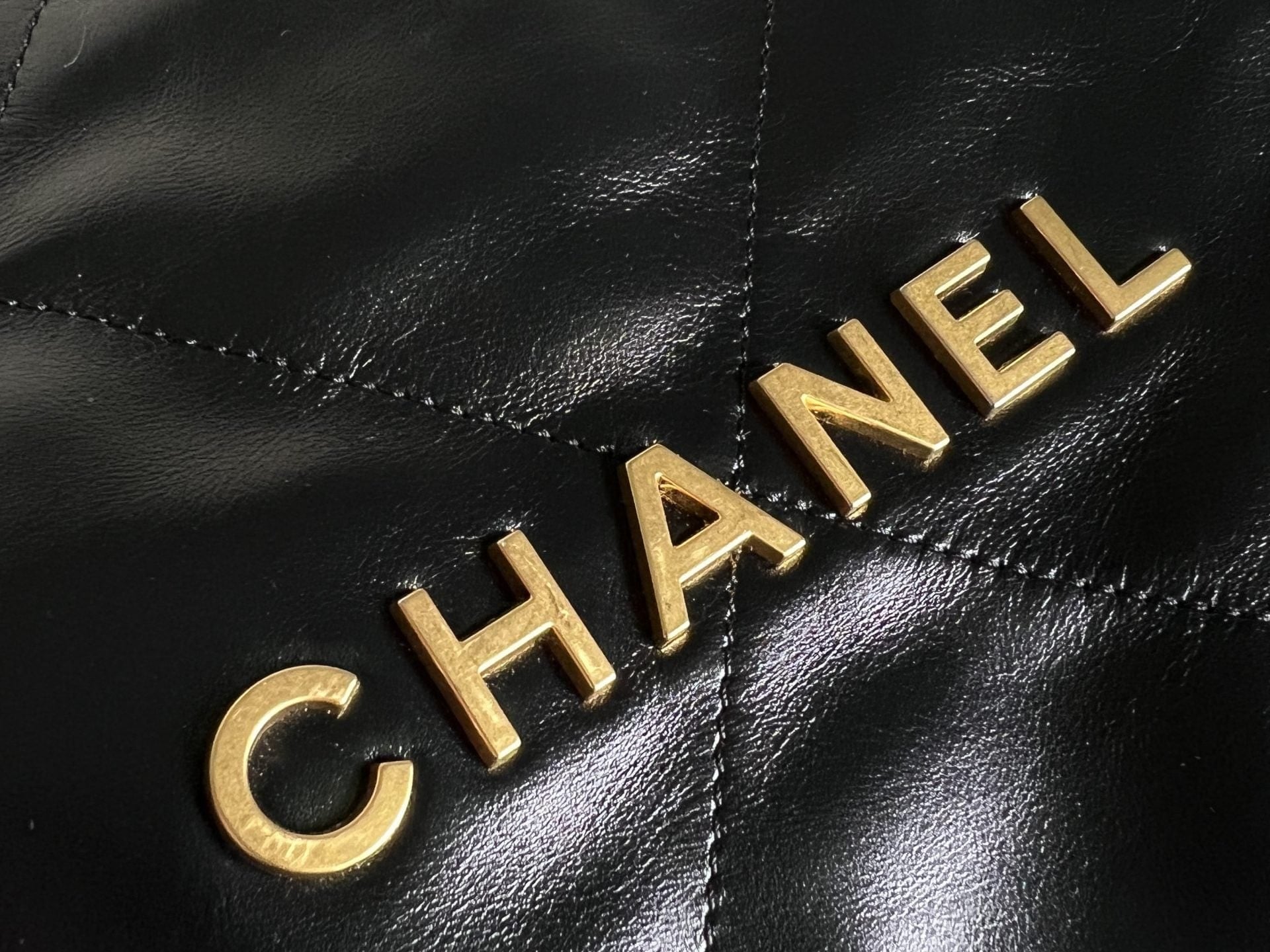 CHANEL Handbag Chanel 22 Shiny Calfskin Quilted Drawstring Bag GHW - Redeluxe
