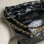 CHANEL Handbag Chanel 22 Shiny Calfskin Quilted Drawstring Bag GHW - Redeluxe