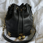 CHANEL Handbag Chanel Black Caviar Vintage Drawstring Gold Hardware - Redeluxe