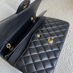 CHANEL Handbag Chanel Black Lambskin Quilted Classic Flap Medium GHW - Redeluxe