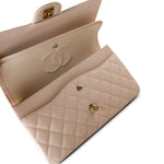 CHANEL Handbag Cream 20C Light Beige Caviar Quilted Classic Flap Medium Light Gold Hardware - Redeluxe