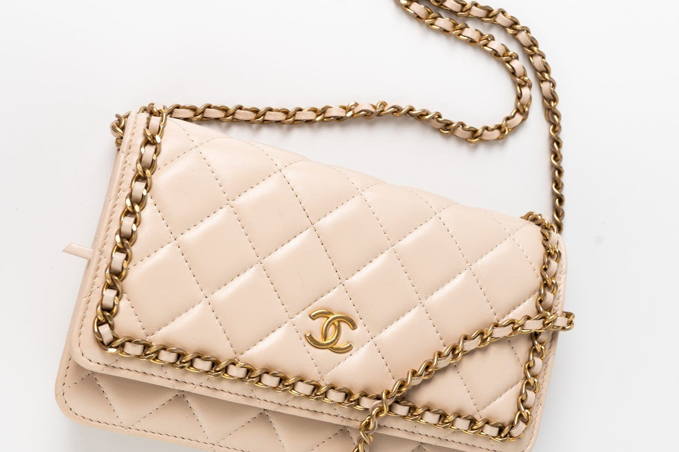 CHANEL Handbag Cream Nude/ Ecru Lambskin Quilted Chain Around Wallet On Chain WOC Aged Gold Hardware - Redeluxe