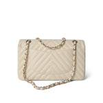 CHANEL Handbag Ivory / Classic flap 18C Ivory Chevron Lambskin Medium Classic Flap Light Gold Hardware - Redeluxe