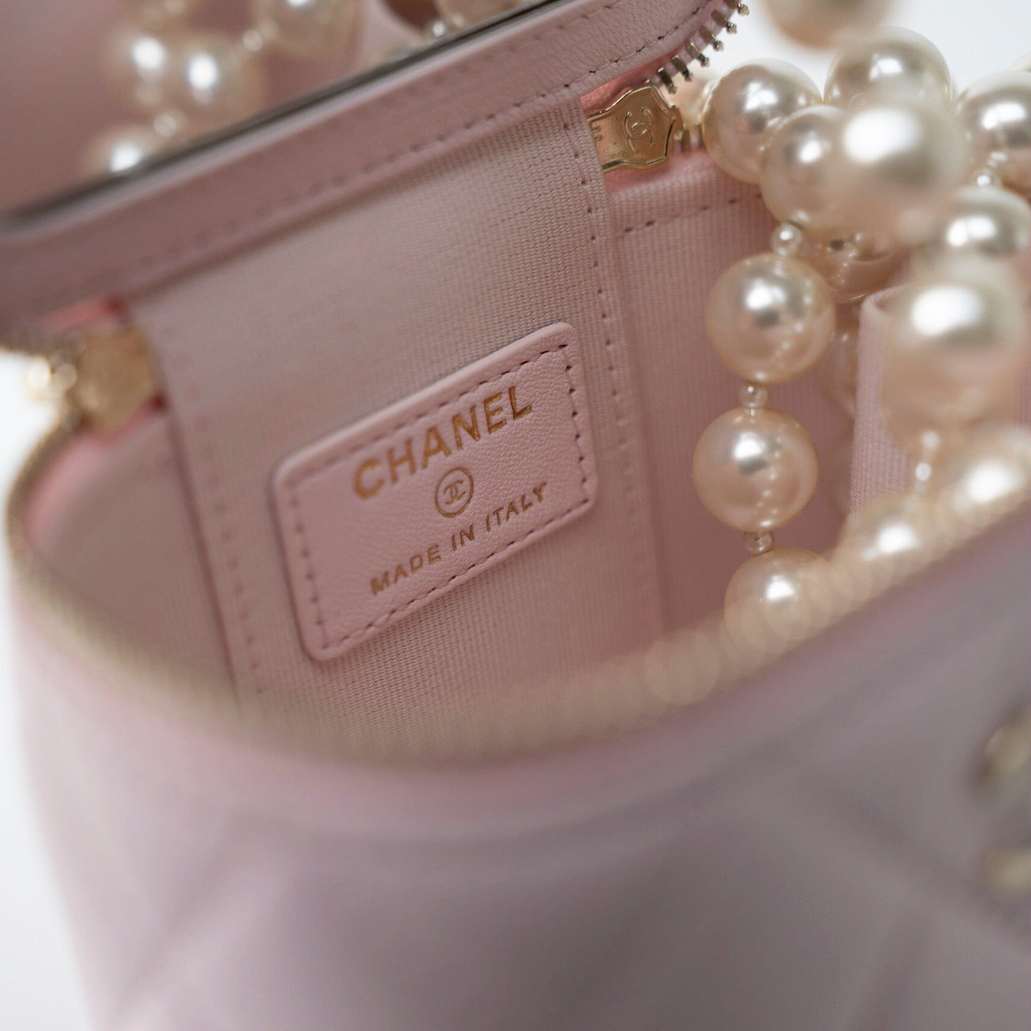 CHANEL Handbag Pink Light Pink Lambskin Quilted Mini Vanity Case With Pearl Chain - Redeluxe