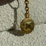 CHANEL Key Holder Gold Chanel Vintage Gold-tone Metal Round Coco Mark Charm Keyholder - Redeluxe
