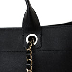 CHANEL Tote Black Caviar Studded Deauville Tote Medium/ Large Light Gold Hardware - Redeluxe