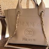 CHANEL Tote CHANEL LIGHT BEIGE MEDIUM DEAUVILLE SHOPPING TOTE STUDDED AGED HARDWARE - Redeluxe