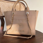 CHANEL Tote CHANEL LIGHT BEIGE MEDIUM DEAUVILLE SHOPPING TOTE STUDDED AGED HARDWARE - Redeluxe