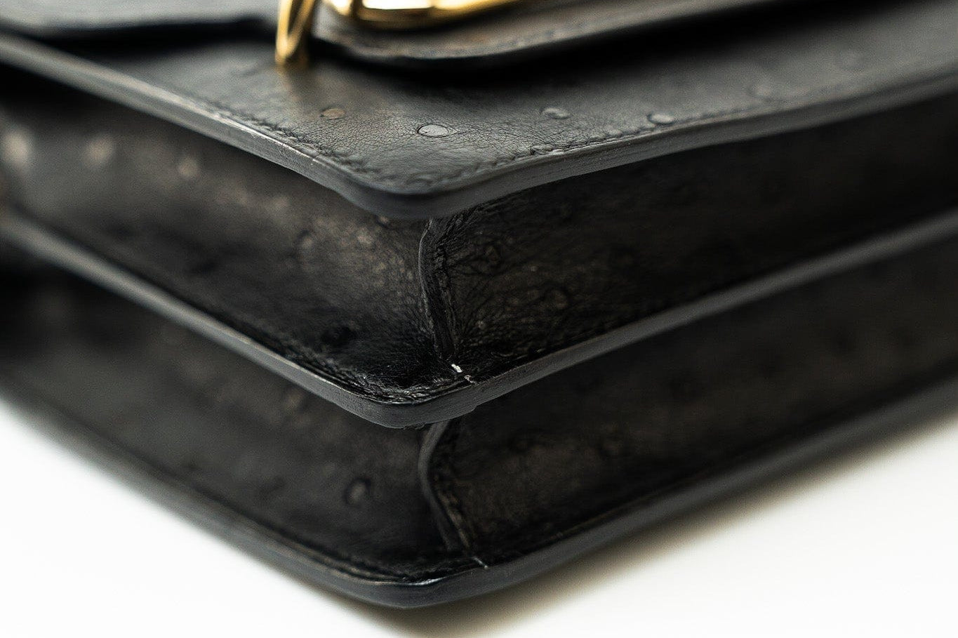 Hermes Handbag Hermès  Mini Roulis Black Ostrich Leather Gold Hardware - Redeluxe