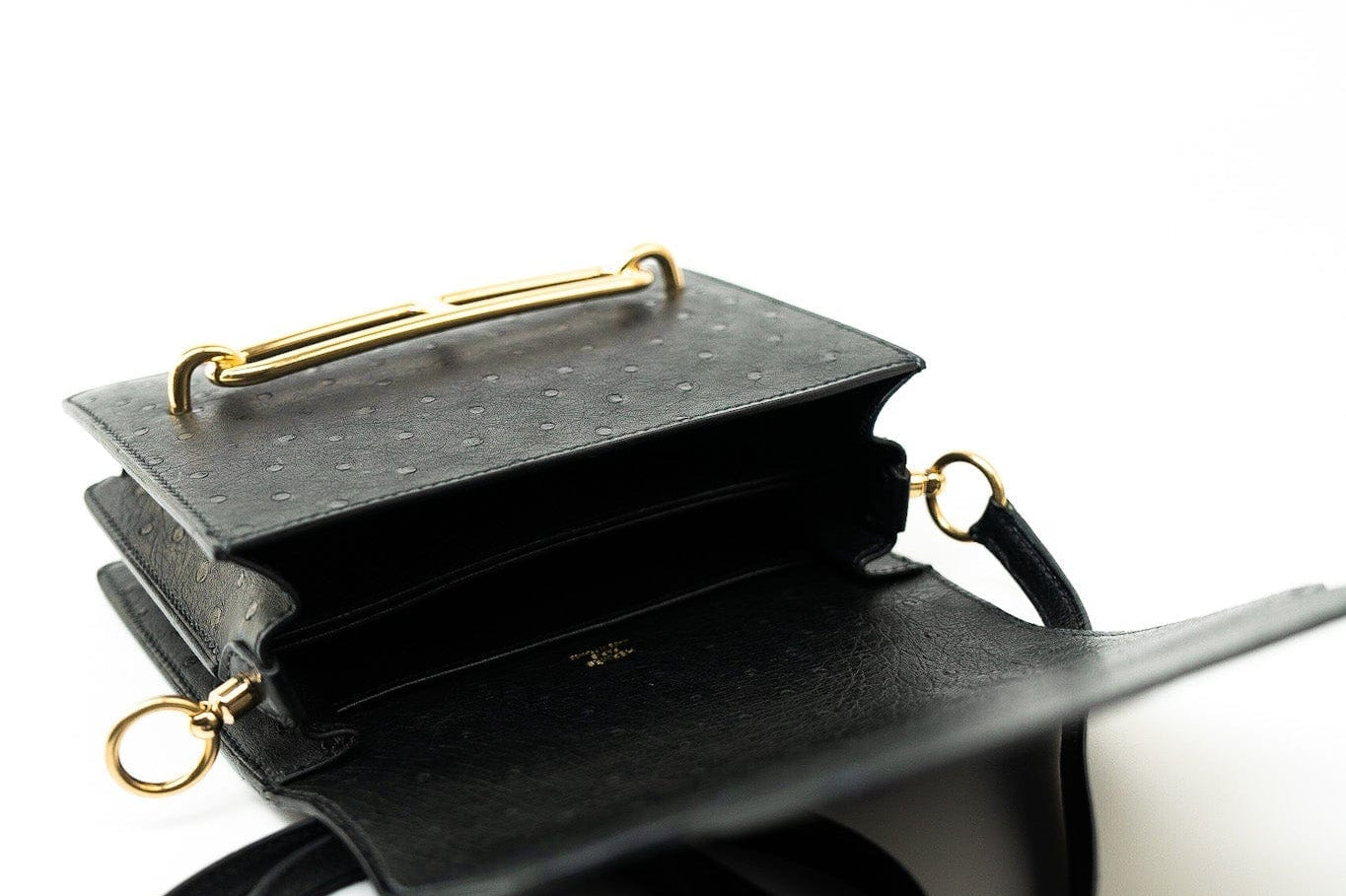 Hermes Handbag Hermès  Mini Roulis Black Ostrich Leather Gold Hardware - Redeluxe