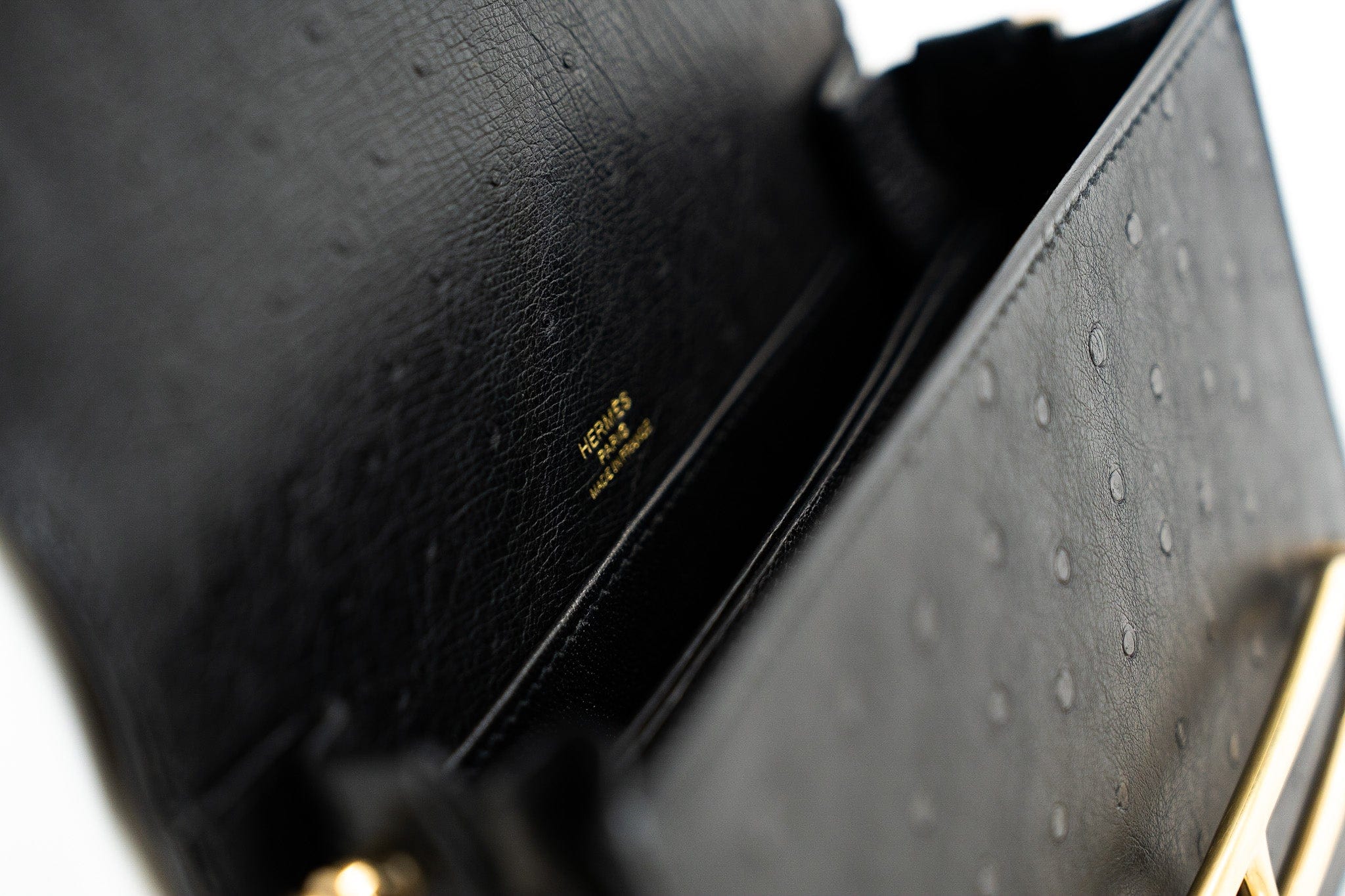 Hermes Handbag Hermès  Mini Roulis Black Ostrich Leather Gold Hardware - Redeluxe